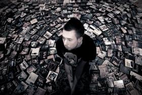 Man with CDs laid out all around him